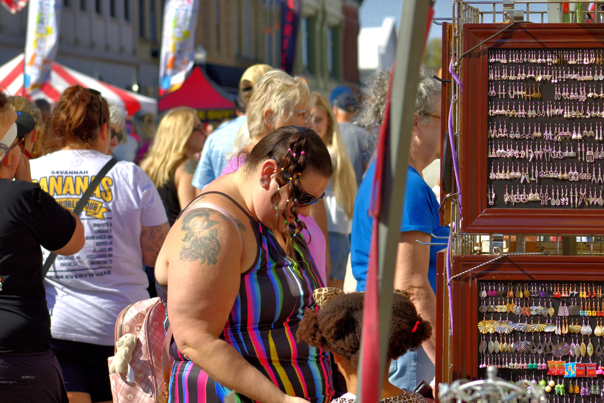 Visitor browsing a display of small handmade items at Baraboo's 2026 Fall Fair on the Square