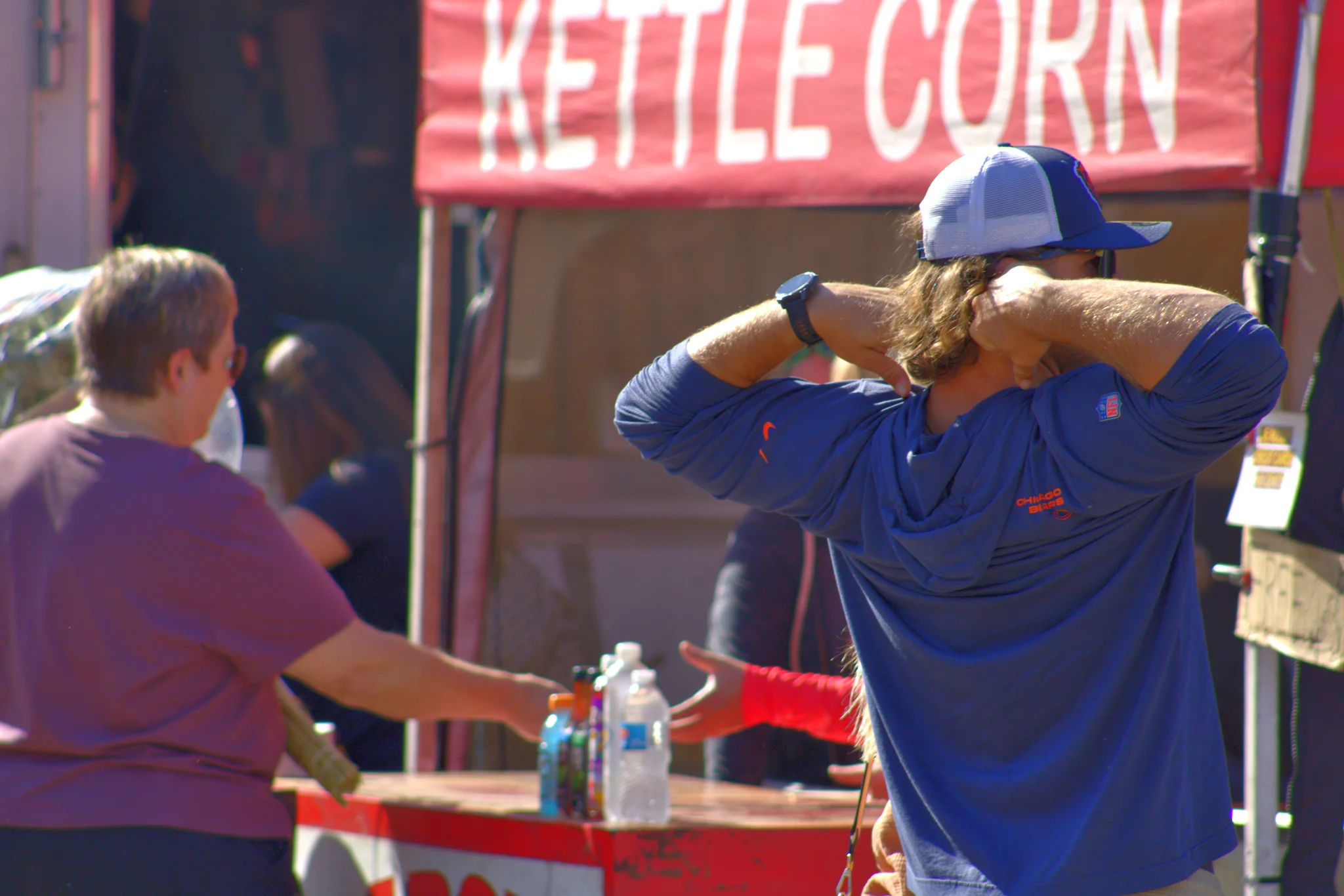 Fair visitor waiting at a kettle corn stand at Baraboo's 2026 Fall Fair on the Square