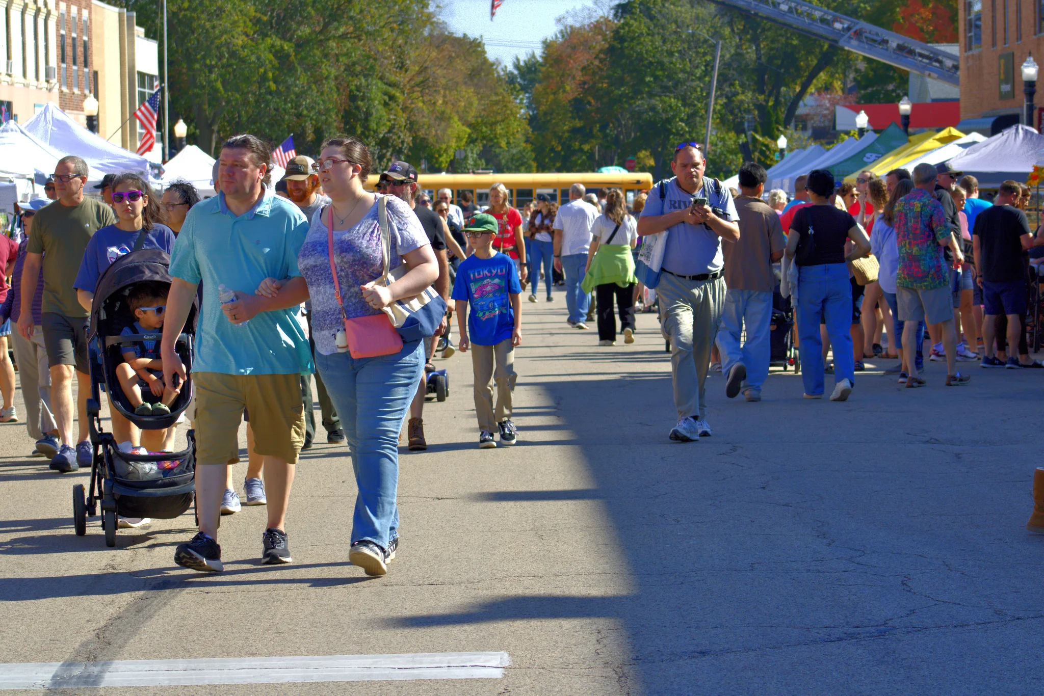 Visitors filling the street between Fall Fair booths at Baraboo's 2026 Fall Fair on the Square