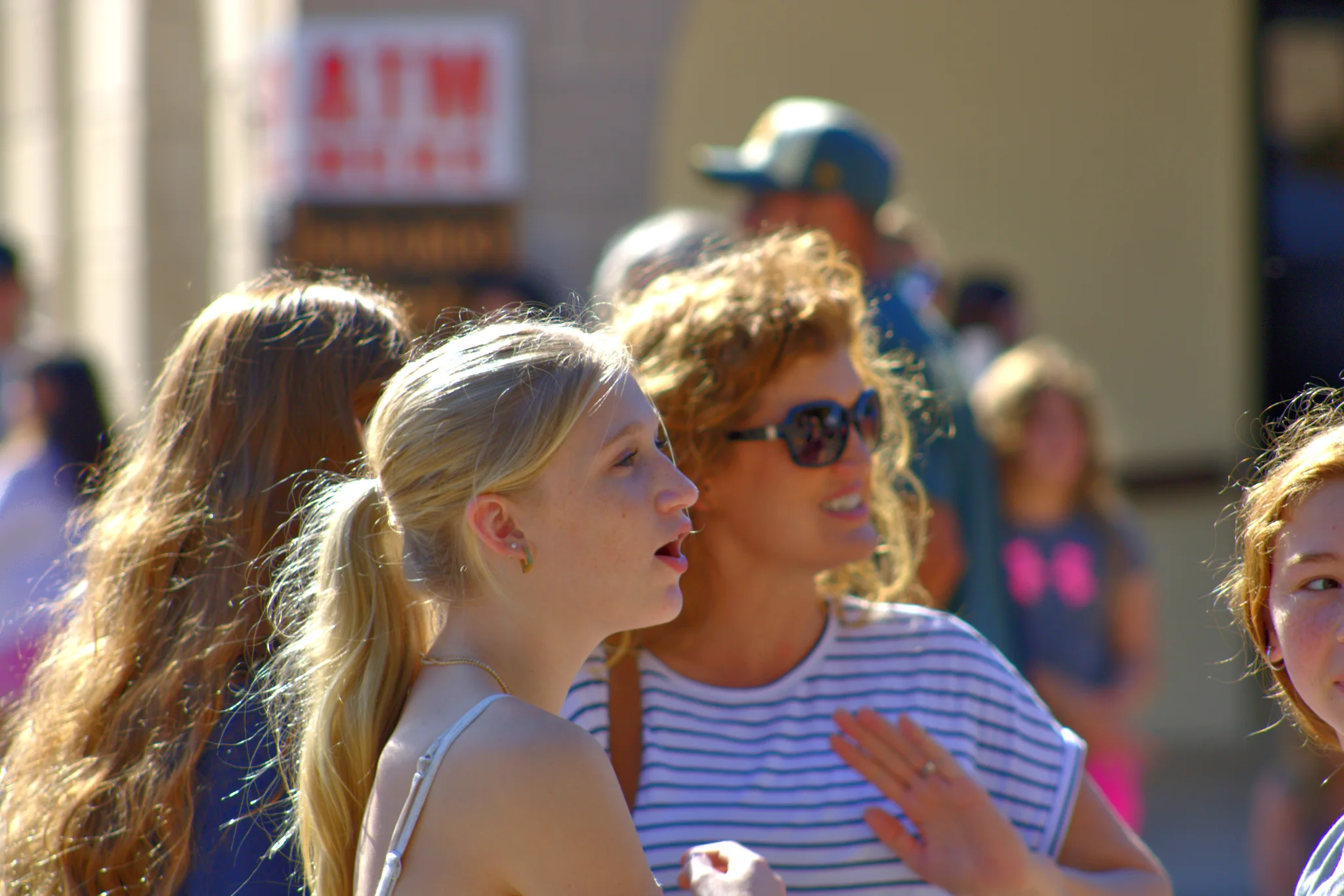 Women talking amid the busy fair crowd at Baraboo's 2026 Fall Fair on the Square