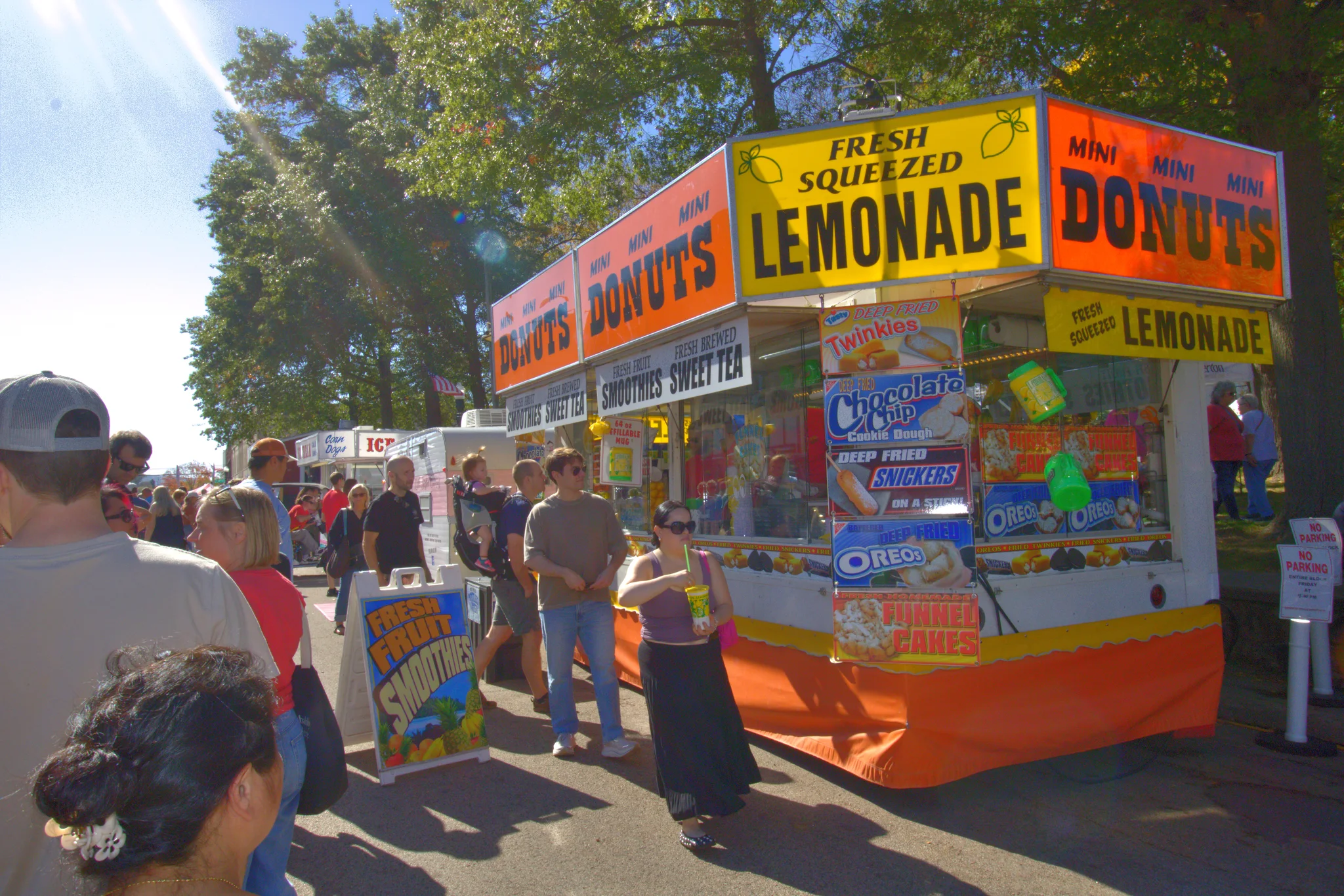 Visitors approaching a bright lemonade and doughnut stand at Baraboo's 2026 Fall Fair on the Square