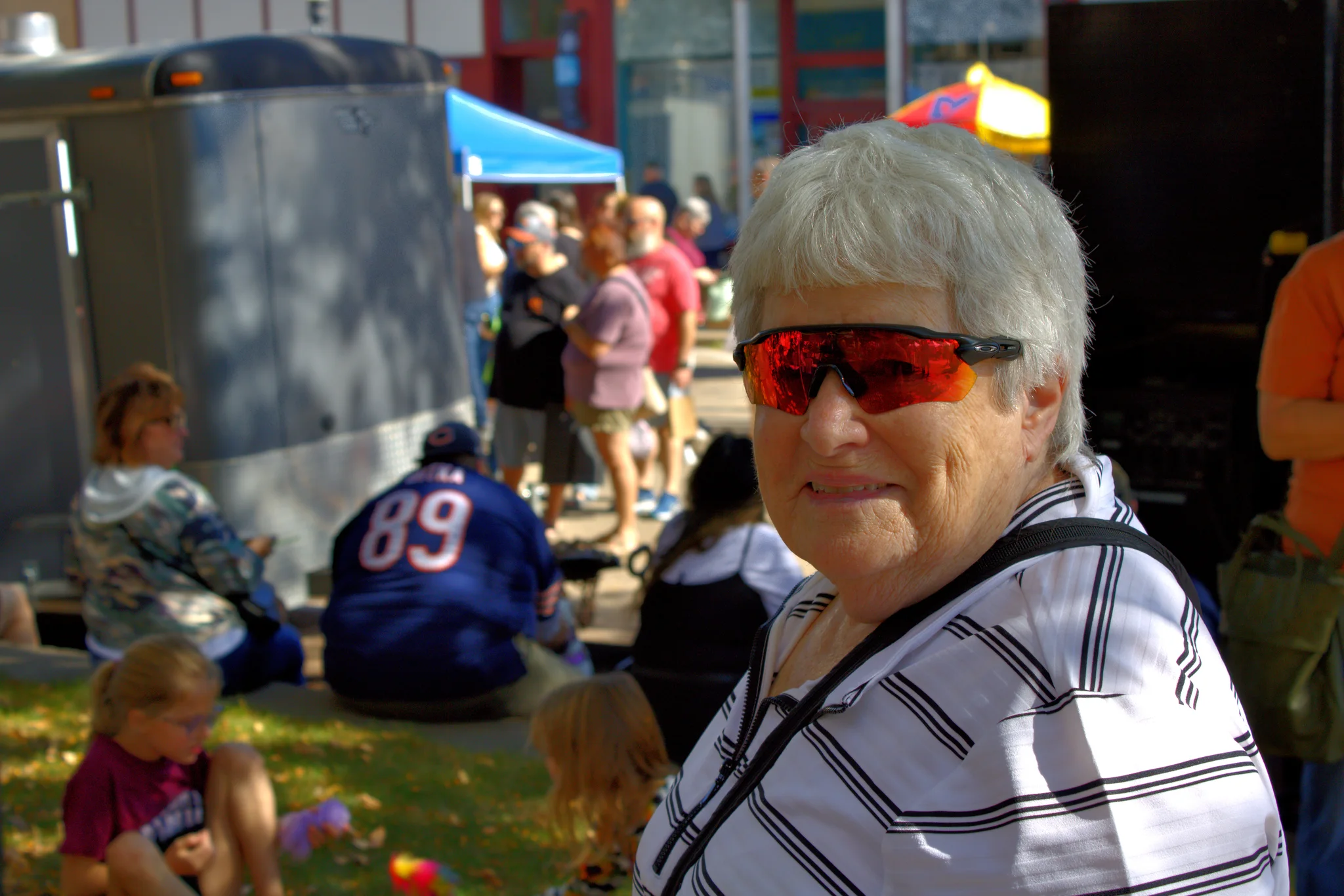 Fair visitor smiling toward the camera at Baraboo's 2026 Fall Fair on the Square