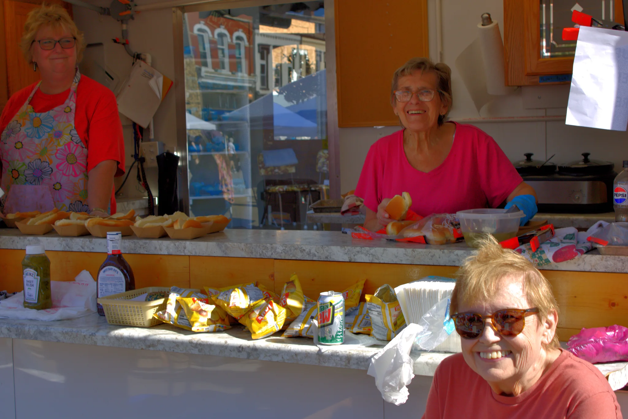 Food vendors serving visitors from a downtown stand at Baraboo's 2026 Fall Fair on the Square