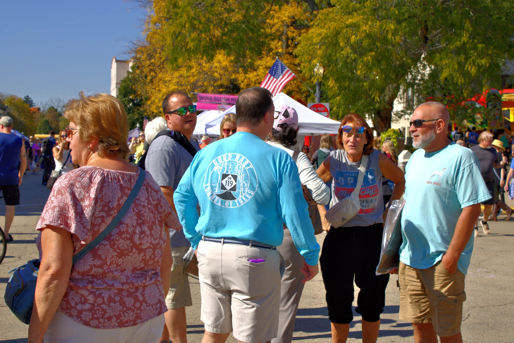 Fairgoers walking and talking along the street at Baraboo's 2026 Fall Fair on the Square