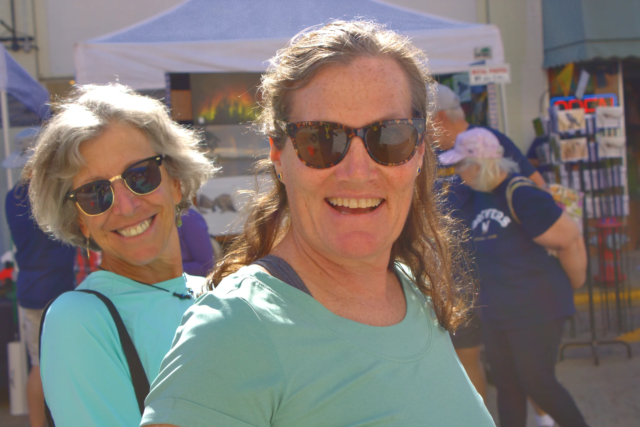 Two smiling visitors enjoying the Fall Fair at Baraboo's 2026 Fall Fair on the Square