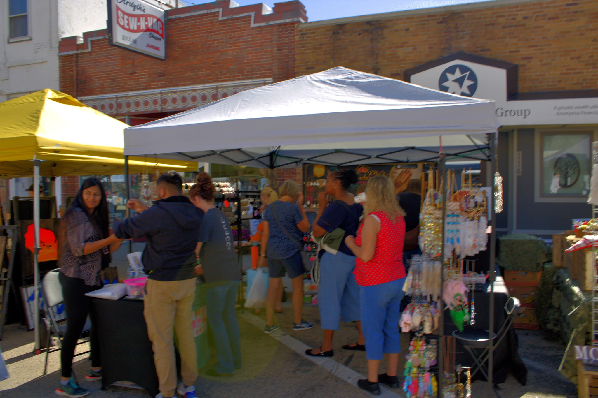 Customers visiting a craft tent on the square at Baraboo's 2026 Fall Fair on the Square
