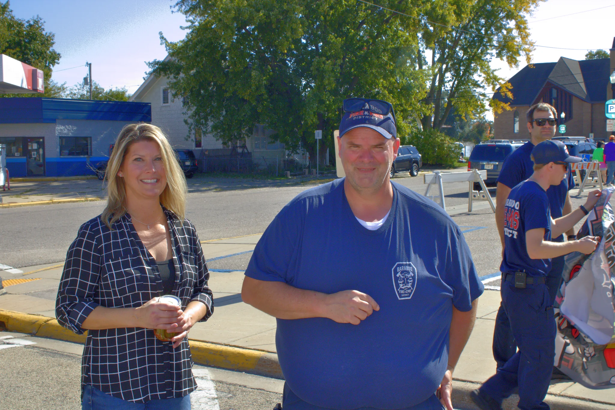 Two smiling visitors standing together near the fair at Baraboo's 2026 Fall Fair on the Square