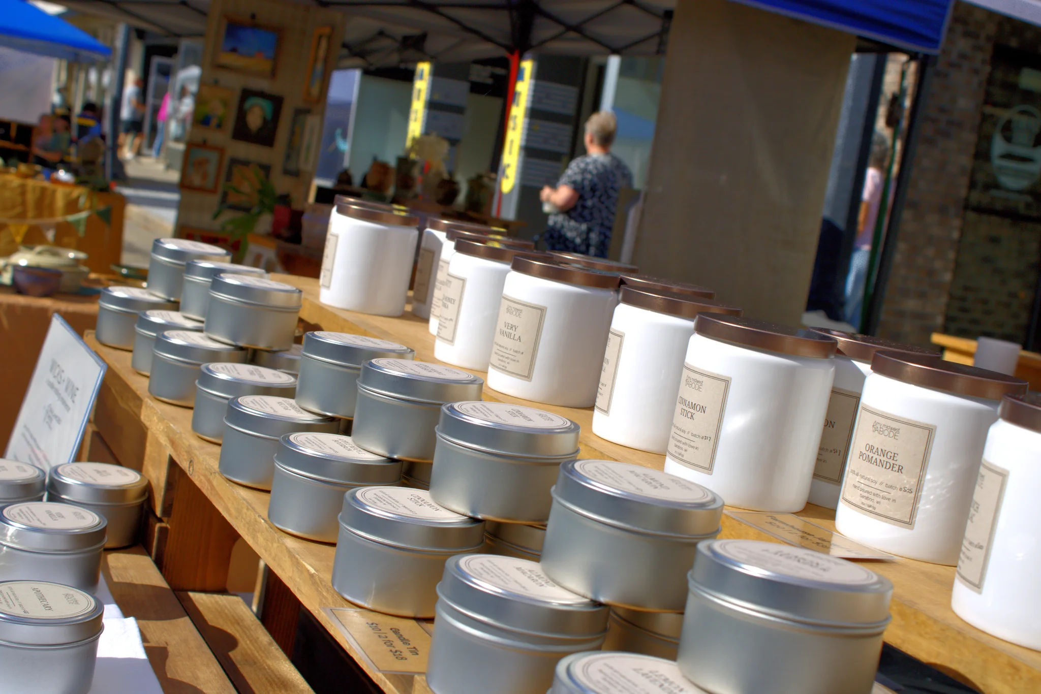 Handmade pottery and containers lined up at a booth at Baraboo's 2026 Fall Fair on the Square