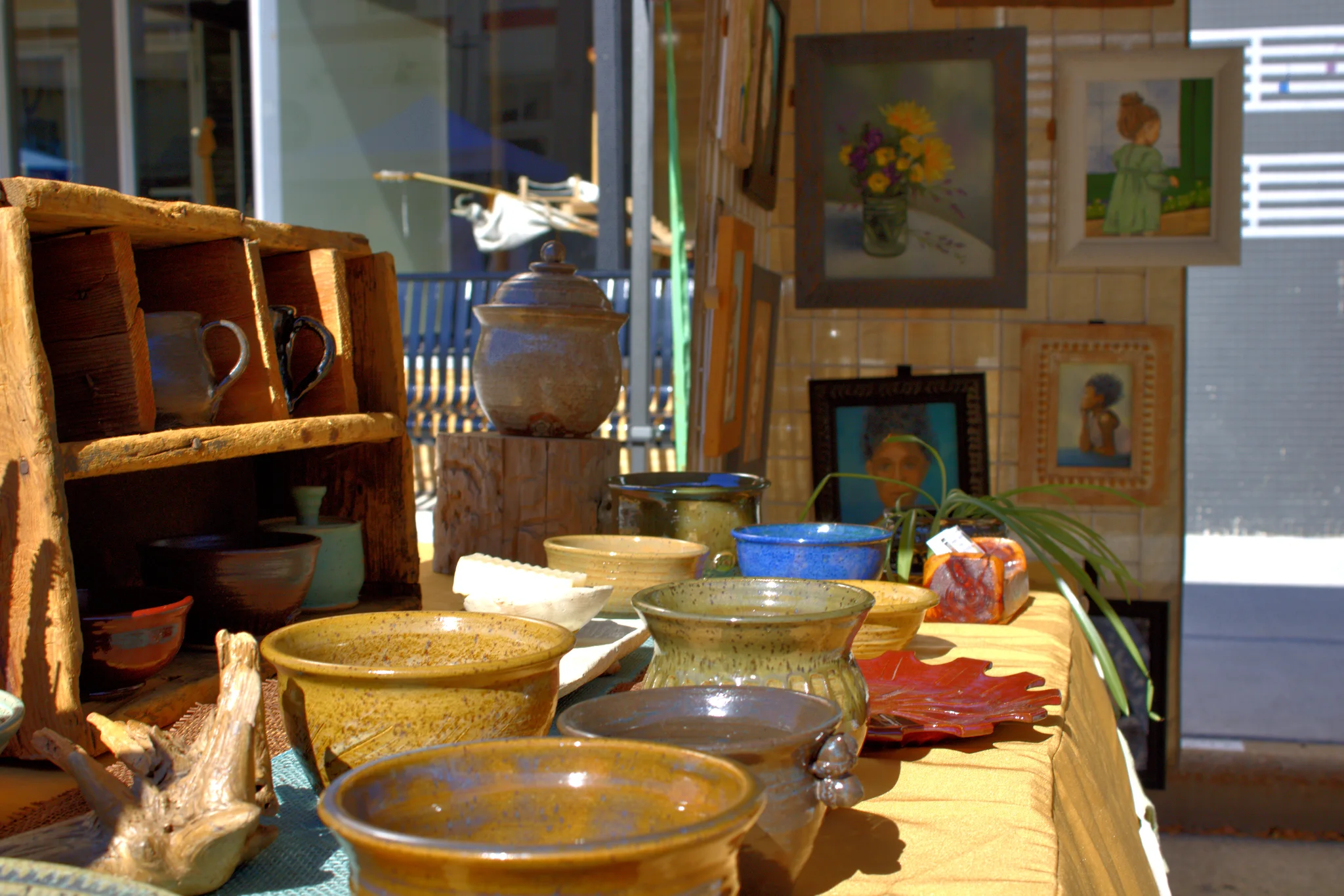 Handmade pottery displayed outside a downtown storefront at Baraboo's 2026 Fall Fair on the Square