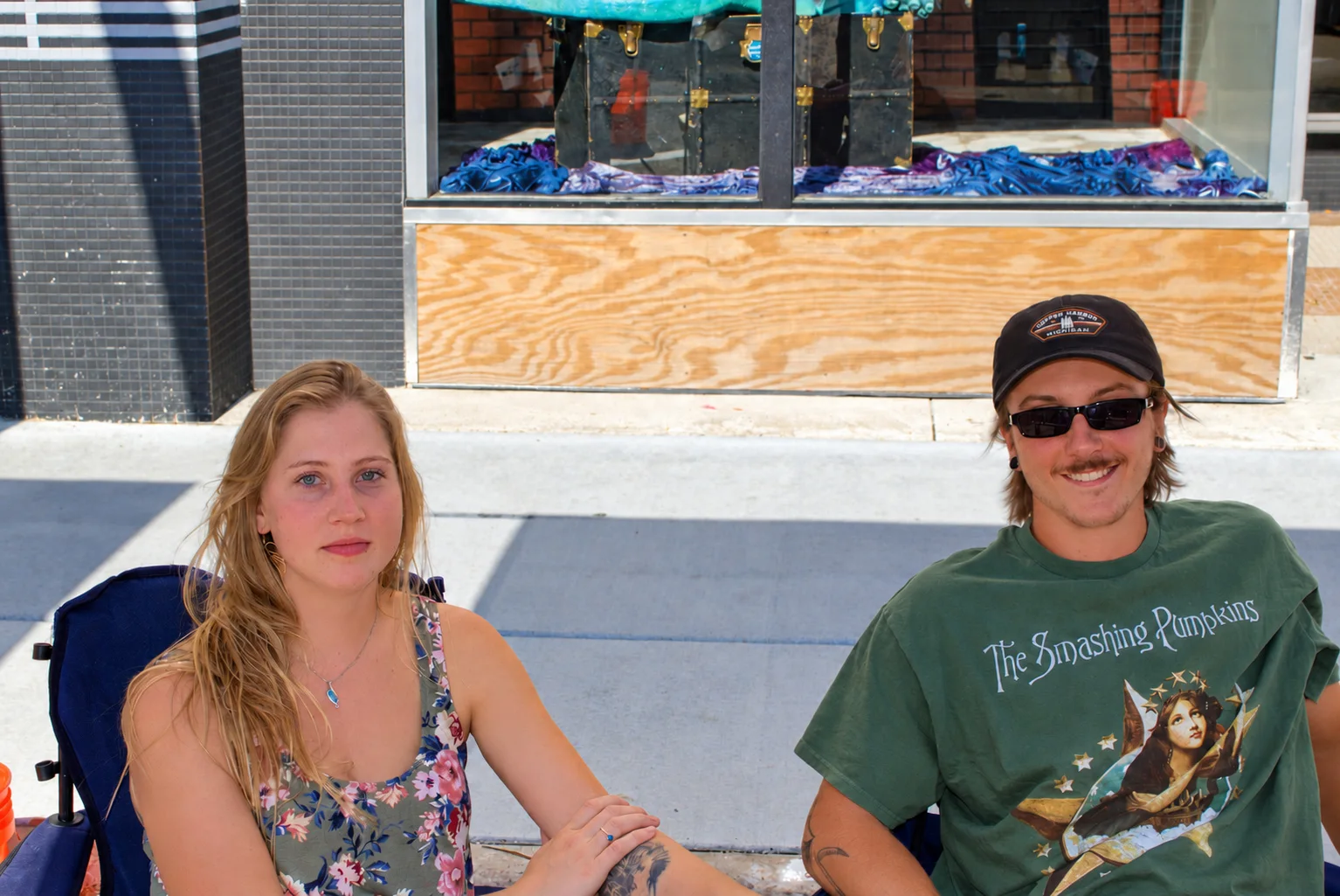 Two fair visitors seated together and smiling at Baraboo's 2026 Fall Fair on the Square