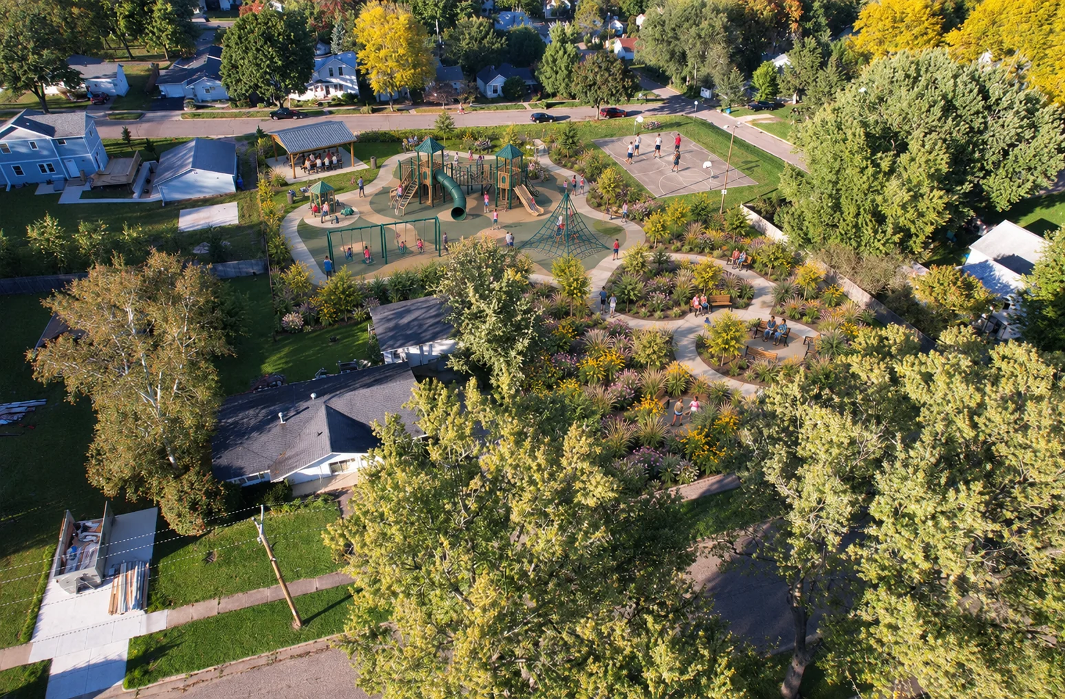 AI-assisted weber park concept visualization: aerial view of play areas and garden walkways