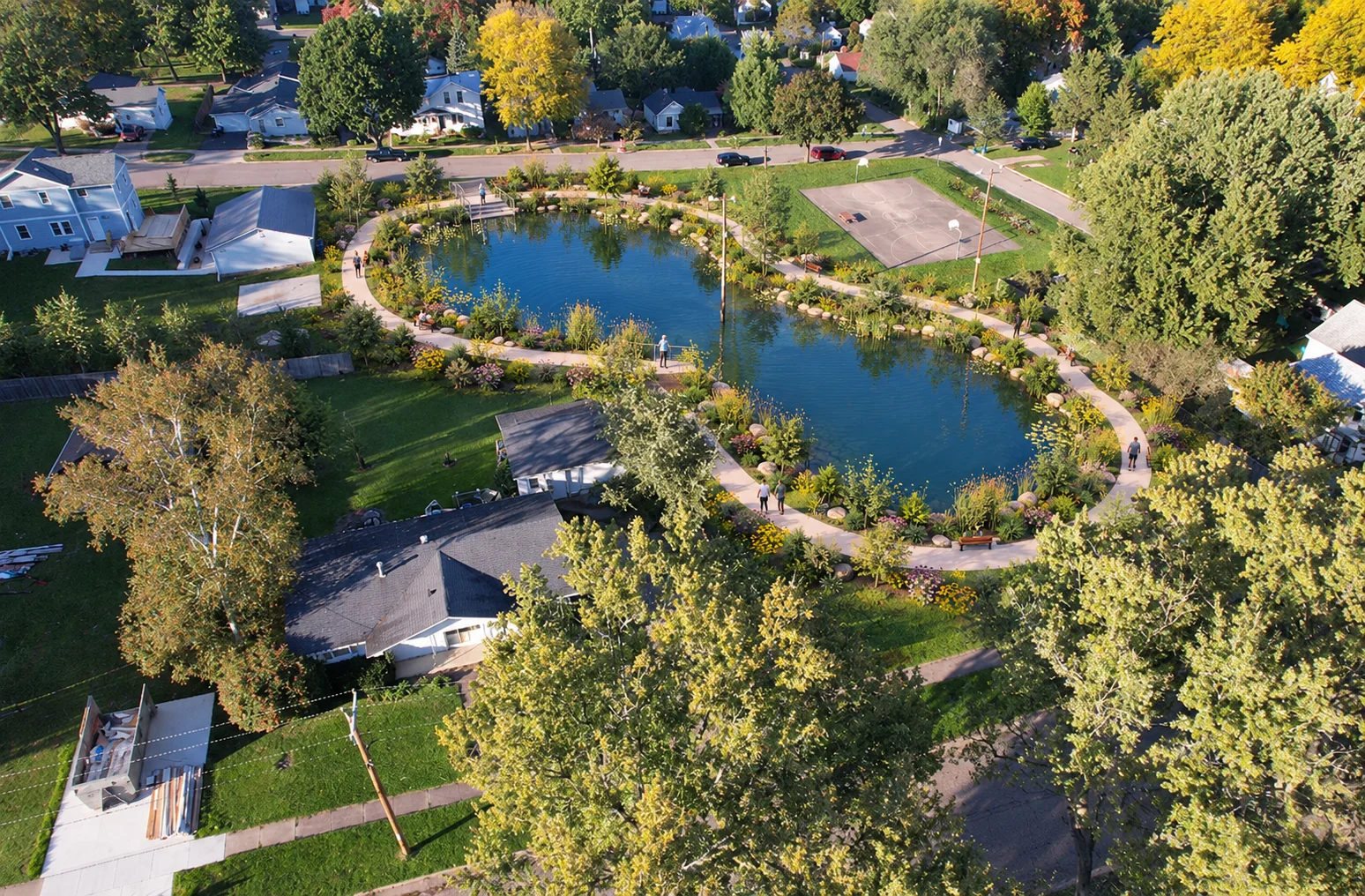 AI-assisted weber pond concept visualization: pond from the neighborhood side of the park