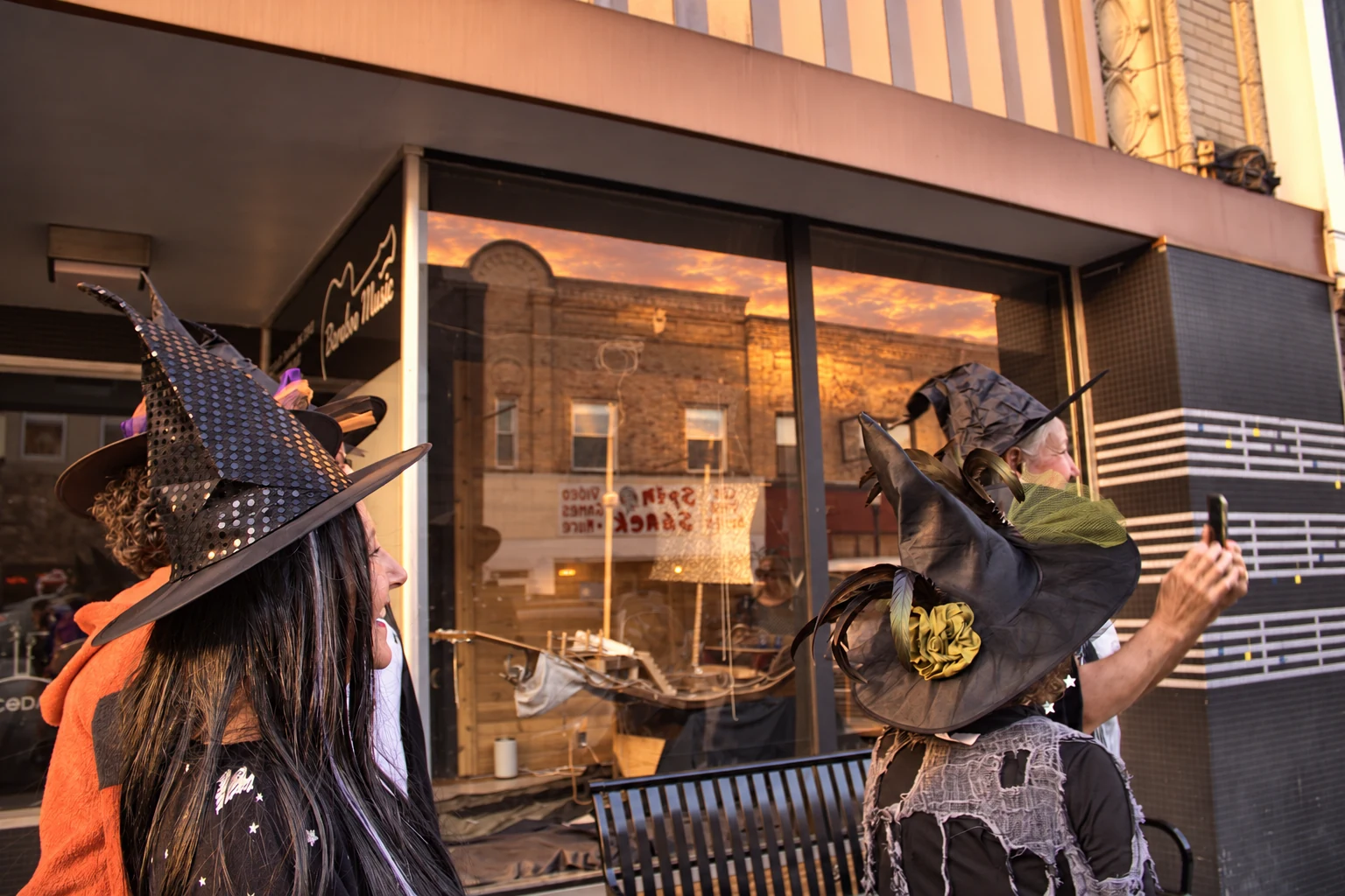 Decorated witch hats seen beside the Baraboo Music window